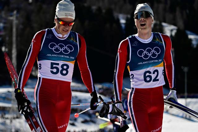 Norway's Harald Oestberg Amundsen (L) and Norway's Einar Hedegart react after competing in the men's 10km cross-country interval start free event of the Milano Cortina 2026 Winter Olympic Games at Tesero Cross-Country Skiing Stadium in Lago di Tesero (Val di Fiemme) on February 13, 2026. (Photo by Tobias SCHWARZ / AFP)