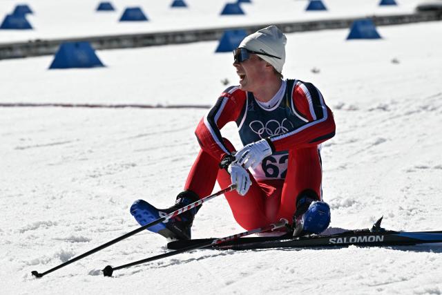 Norway's Einar Hedegart reacts after crossing the finish line during the men's 10km cross-country interval start free event of the Milano Cortina 2026 Winter Olympic Games at Tesero Cross-Country Skiing Stadium in Lago di Tesero (Val di Fiemme) on February 13, 2026. (Photo by Javier SORIANO / AFP)