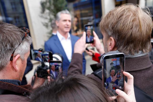 The Governor of California and politician of the Democratic Party Gavin Newsom (C) gives an interview as he arrives to attend the 62nd Munich Security Conference (MSC) on February 13, 2026 in Munich, southern Germany. Heads of state and government as well as foreign and defence ministers from all over the world are expected to attend the security policy talks from February 13 to 15, 2026. (Photo by Michaela STACHE / AFP)