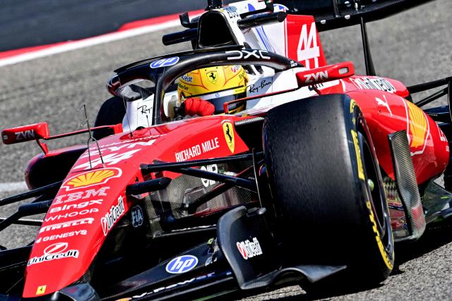 TOPSHOT - Ferrari's British driver Lewis Hamilton drives on the third day of the Formula One pre-season testing at the Bahrain International Circuit in Sakhir on February 13, 2026. (Photo by Giuseppe CACACE / AFP)