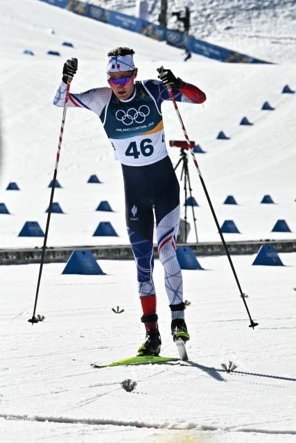 France's Mathis Desloges sprints to the finish line during the men's 10km cross-country interval start free event of the Milano Cortina 2026 Winter Olympic Games at Tesero Cross-Country Skiing Stadium in Lago di Tesero (Val di Fiemme) on February 13, 2026. (Photo by Javier SORIANO / AFP)