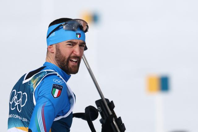 Italy's Nicola Romanin prepares to participate in the men's biathlon 10km sprint event during the Milano Cortina 2026 Winter Olympic Games at the Anterselva Biathlon Arena (Sudtirol Arena) in Anterselva (Val Pusteria) on February 13, 2026. (Photo by FRANCK FIFE / AFP)