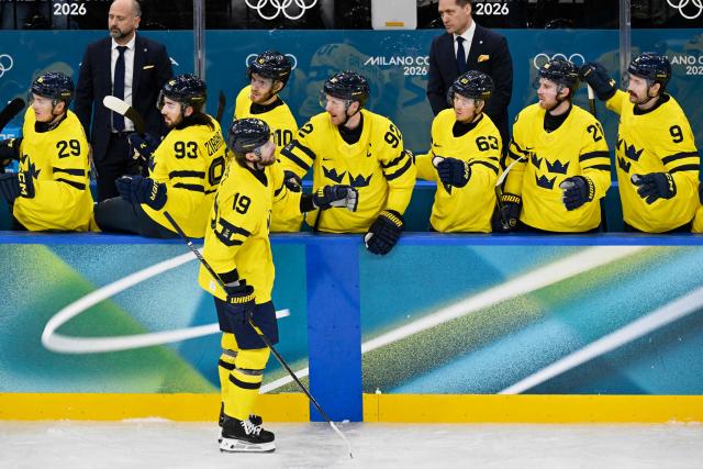 Sweden's players celebrate a team goal  during the men's preliminary round Group B Ice Hockey match between Finland and Sweden at the Milano Santagiulia Ice Hockey Arena during the Milano Cortina 2026 Winter Olympic Games in Milan, on February 13, 2026. (Photo by Alexander NEMENOV / AFP)
