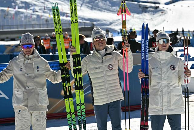 (From L) Silver medallist France's Mathis Desloges, gold medallist Norway's Johannes Hoesflot Klaebo and bronze medallist Norway's Einar Hedegart celebrate after the men's 10km cross-country interval start free event of the Milano Cortina 2026 Winter Olympic Games at Tesero Cross-Country Skiing Stadium in Lago di Tesero (Val di Fiemme) on February 13, 2026. (Photo by Javier SORIANO / AFP)