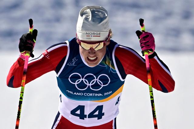 Norway's Johannes Hoesflot Klaebo sprints to the finish line during the men's 10km cross-country interval start free event of the Milano Cortina 2026 Winter Olympic Games at Tesero Cross-Country Skiing Stadium in Lago di Tesero (Val di Fiemme) on February 13, 2026. (Photo by Tobias SCHWARZ / AFP)