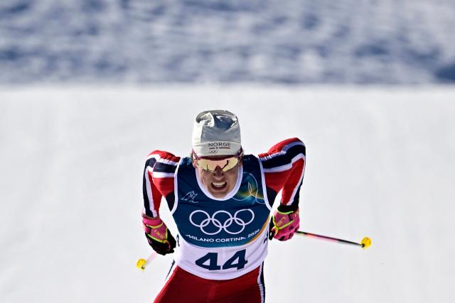 Norway's Johannes Hoesflot Klaebo sprints to the finish line during the men's 10km cross-country interval start free event of the Milano Cortina 2026 Winter Olympic Games at Tesero Cross-Country Skiing Stadium in Lago di Tesero (Val di Fiemme) on February 13, 2026. (Photo by Tobias SCHWARZ / AFP)
