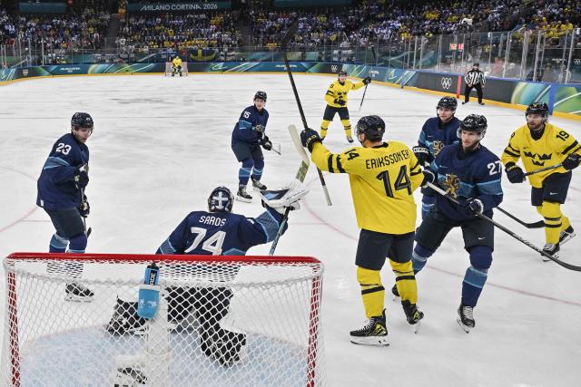 Sweden's players celebrate a goal  during the men's preliminary round Group B Ice Hockey match between Finland and Sweden at the Milano Santagiulia Ice Hockey Arena during the Milano Cortina 2026 Winter Olympic Games in Milan, on February 13, 2026. (Photo by Alexander NEMENOV / AFP)