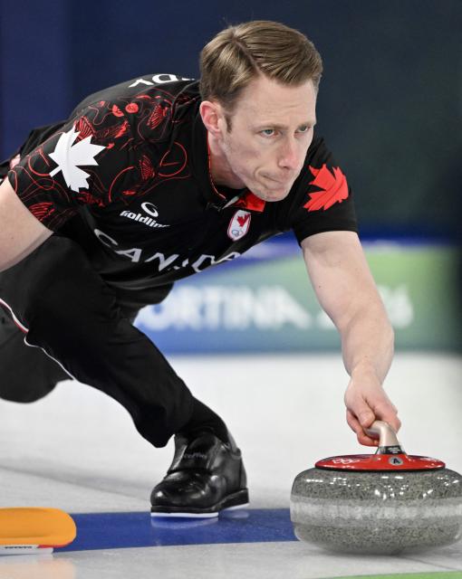 Marc Kennedy of Team Canada competes in the curling men's round robin between Canada and USA during the Milano Cortina 2026 Winter Olympic Games at the Cortina Curling Olympic Stadium in Cortina d’Ampezzo on February 13, 2026. (Photo by Tiziana FABI / AFP)