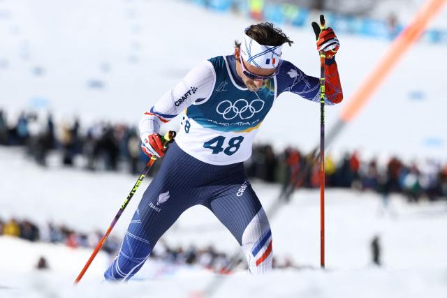 France's Hugo Lapalus competes during the men's 10km cross-country interval start free event of the Milano Cortina 2026 Winter Olympic Games at Tesero Cross-Country Skiing Stadium in Lago di Tesero (Val di Fiemme) on February 13, 2026. (Photo by Anne-Christine POUJOULAT / AFP)