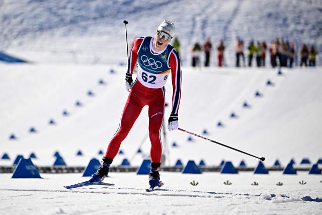 Norway's Einar Hedegart crosses the finish line during the men's 10km cross-country interval start free event of the Milano Cortina 2026 Winter Olympic Games at Tesero Cross-Country Skiing Stadium in Lago di Tesero (Val di Fiemme) on February 13, 2026. (Photo by Tobias SCHWARZ / AFP)
