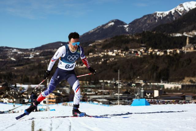 France's Jules Lapierre competes during the men's 10km cross-country interval start free event of the Milano Cortina 2026 Winter Olympic Games at Tesero Cross-Country Skiing Stadium in Lago di Tesero (Val di Fiemme) on February 13, 2026. (Photo by Anne-Christine POUJOULAT / AFP)