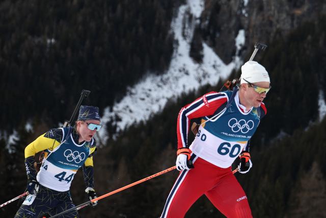 Sweden's Sebastian Samuelsson and Norway's Vetle Sjaastad Christiansen compete in the men's biathlon 10km sprint event during the Milano Cortina 2026 Winter Olympic Games at the Anterselva Biathlon Arena (Sudtirol Arena) in Anterselva (Val Pusteria) on February 13, 2026. (Photo by Franck FIFE / AFP)