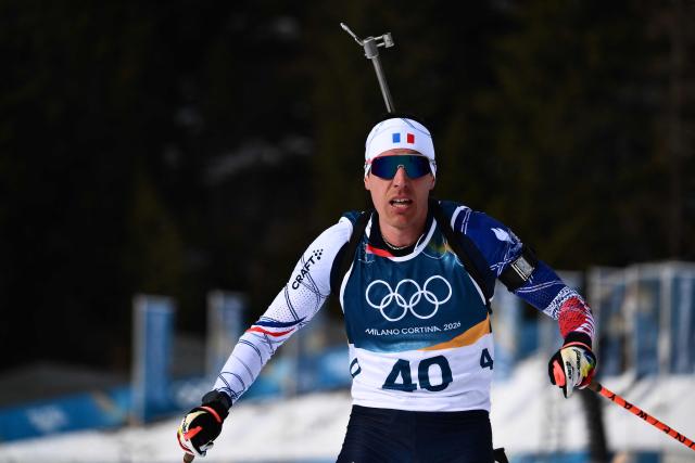 France's Quentin Fillon Maillet crosses the finish line of the men's biathlon 10km sprint event during the Milano Cortina 2026 Winter Olympic Games at the Anterselva Biathlon Arena (Sudtirol Arena) in Anterselva (Val Pusteria) on February 13, 2026. (Photo by Marco BERTORELLO / AFP)
