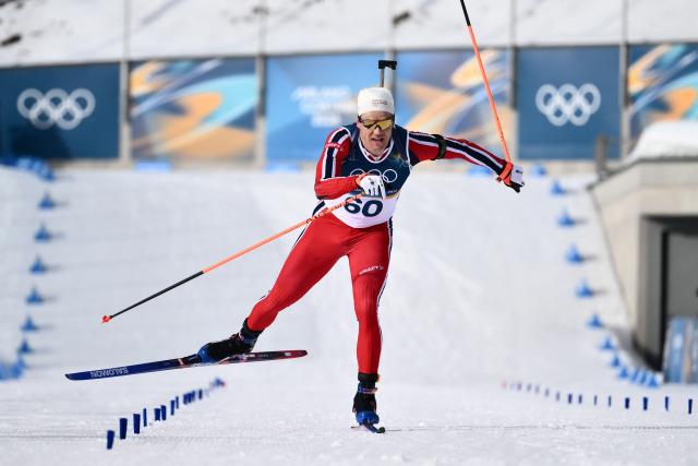 Norway's Vetle Sjaastad Christiansen crosses the finish line of the men's biathlon 10km sprint event during the Milano Cortina 2026 Winter Olympic Games at the Anterselva Biathlon Arena (Sudtirol Arena) in Anterselva (Val Pusteria) on February 13, 2026. (Photo by Marco BERTORELLO / AFP)