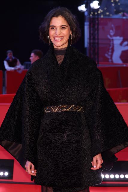 French actress Eya Bouteraa poses on the red carpet for the premiere of the film "A voix basse" (In a Whisper) presented in competition at the 76th Berlinale, Europe's first major film festival of the year, in Berlin on February 13, 2026. (Photo by Ronny HARTMANN / AFP)