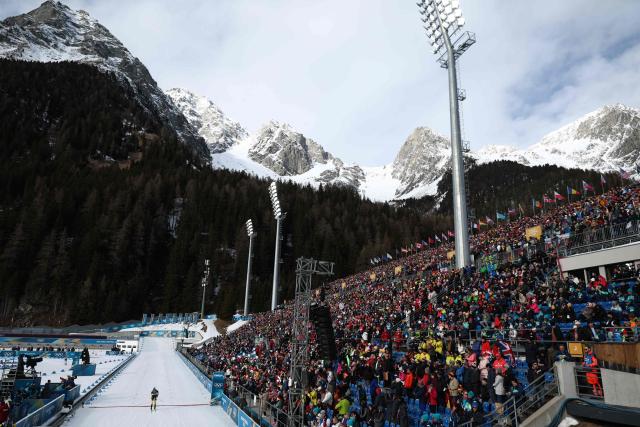 An athlete crosses the finish line in the men's biathlon 10km sprint event during the Milano Cortina 2026 Winter Olympic Games at the Anterselva Biathlon Arena (Sudtirol Arena) in Anterselva (Val Pusteria) on February 13, 2026. (Photo by Franck FIFE / AFP)