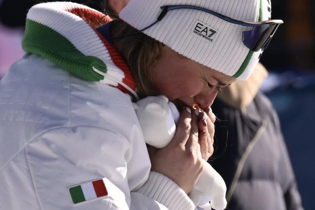 Bronze medallist Italy's Michela Moioli cries on the podium after the snowboard women's cross final during the Milano Cortina 2026 Winter Olympic Games at Livigno Snow Park, in Livigno (Valtellina), on February 13, 2026. (Photo by Jeff PACHOUD / AFP)