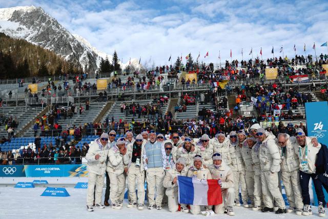 Gold medalist France's Quentin Fillon Maillet (C) poses with teammates after the podium ceremony of the men's biathlon 10km sprint event during the Milano Cortina 2026 Winter Olympic Games at the Anterselva Biathlon Arena (Sudtirol Arena) in Anterselva (Val Pusteria) on February 13, 2026. (Photo by Franck FIFE / AFP)
