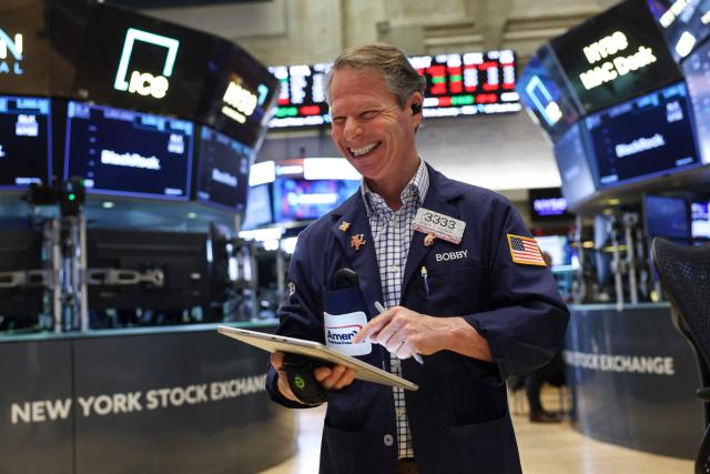A Trader works on the floor of the New York Stock Exchange (NYSE) at the opening bell on February 13, 2026  in New York City. Wall Street stocks moved sideways early Friday following the prior session's selloff after data showing US consumer inflation cooled a bit in December. (Photo by ANGELA WEISS / AFP)