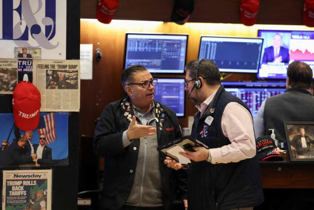 Traders works on the floor of the New York Stock Exchange (NYSE) at the opening bell on February 13, 2026  in New York City. Wall Street stocks moved sideways early Friday following the prior session's selloff after data showing US consumer inflation cooled a bit in December. (Photo by ANGELA WEISS / AFP)