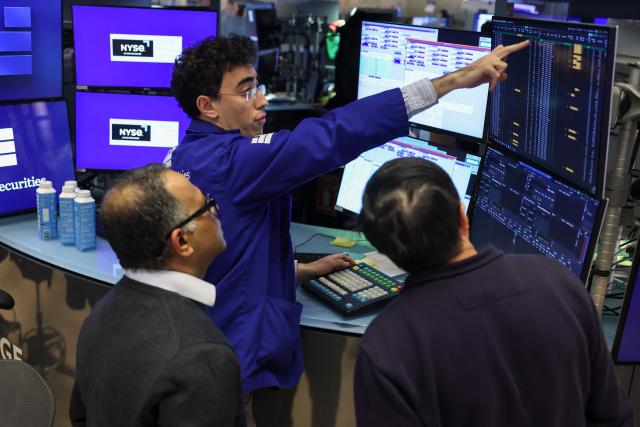Traders works on the floor of the New York Stock Exchange (NYSE) at the opening bell on February 13, 2026  in New York City. Wall Street stocks moved sideways early Friday following the prior session's selloff after data showing US consumer inflation cooled a bit in December. (Photo by ANGELA WEISS / AFP)