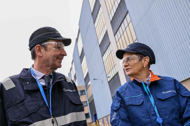 Electricite de France (EDF) Chairman and CEO Bernard Fontana (L) speaks with Arabelle Solutions' CEO Catherine Cornand, during a visit to "Arabelle Solutions" nuclear power company in Belfort, eastern France on February 13, 2026. (Photo by SEBASTIEN BOZON / AFP)