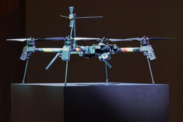 A drone, decorated in the colors of Ukraine and Germany, is pictured during a visit of the Ukrainian President and the German Defence Minister at the production facility of drone producing company Quantum Frontline Industries (QFI) in Gilching near Munich, southern Germany, on the sidelines of the 62nd Munich Security Conference (MSC) on February 13, 2026. Heads of state and government as well as foreign and defence ministers from all over the world are expected to attend the security policy talks from February 13 to 15, 2026. (Photo by Alexandra BEIER / AFP)