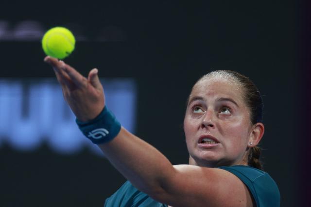 Latvia's Jelena Ostapenko serves against Canada's Victoria Mboko during their women’s singles semi-final match at the Qatar Open tennis tournament in Doha on February 13, 2026. (Photo by Karim JAAFAR / AFP)