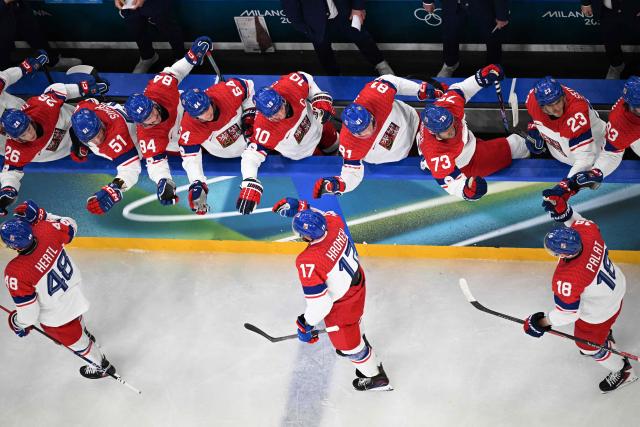 celebrate a team goal  during men's preliminary round Group A Ice Hockey match between France and Czech Republic at the Milano Santagiulia Ice Hockey Arena during the Milano Cortina 2026 Winter Olympic Games in Milan, on February 13, 2026. (Photo by Alexander NEMENOV / AFP)