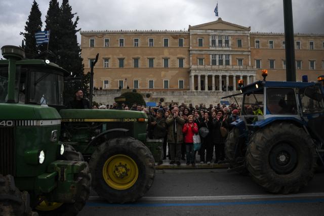 Greek farmers gather as they protest with tractors outside Greek parliament during a demonstration in Athens on February 13, 2026. (Photo by Angelos TZORTZINIS / AFP)
