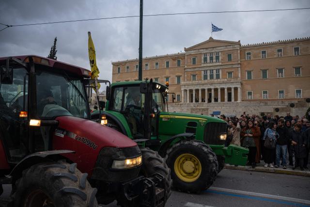 Greek farmers take part with their tractors in a protest over long delays in subsidy payments, low prices, rising energy costs and worsening climate conditions, outside the parliament in Athens on February 13, 2026. (Photo by Angelos TZORTZINIS / AFP)