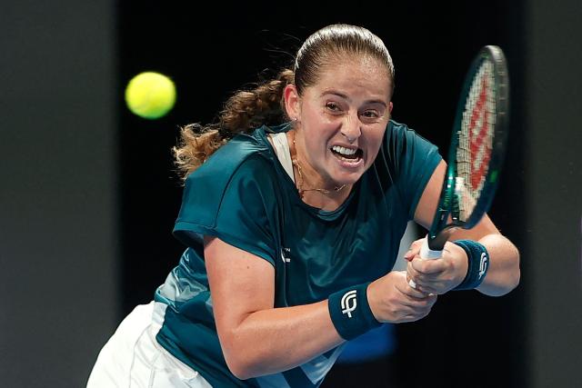 Latvia's Jelena Ostapenko hits a return against Canada's Victoria Mboko during their women’s singles semi-final match at the Qatar Open tennis tournament in Doha on February 13, 2026. (Photo by Karim JAAFAR / AFP)