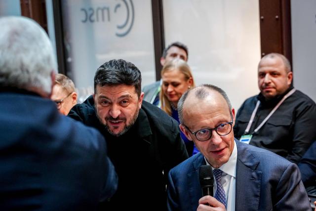 Ukrainian President Volodymyr Zelensky and German Chancellor Friedrich Merz attend a so-called "Berliner Format " meeting at the Munich Security Conference, on February 13, 2026 in Munich. Heads of state and government as well as foreign and defence ministers from all over the world are expected to attend the security policy talks from February 13 to 15, 2026. (Photo by Kay Nietfeld / POOL / AFP)