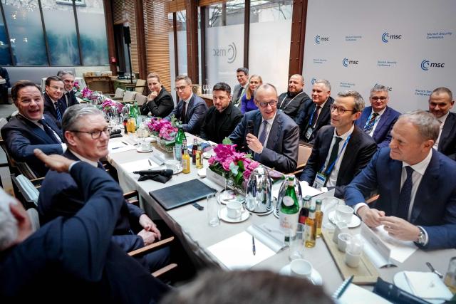 (Clockwise from L-R) British Prime Minister Keir Starmer, NATO Secretary General Mark Rutte, Swedish Prime Minister Ulf Kristersson, Netherlands' Prime Minister Dick Schoof, Danish Prime Minister Mette Frederiksen, Finnish President Alexander Stubb, Ukrainian President Volodymyr Zelensky, German Chancellor Friedrich Merz, Germany's Political Director of the Ministry of Foreign Affairs Gunter Sautter and Polish Prime Minister Donald Tusk attend a so-called "Berlin Format" meeting at the Munich Security Conference, on February 13, 2026 in Munich. Heads of state and government as well as foreign and defence ministers from all over the world are expected to attend the security policy talks from February 13 to 15, 2026. (Photo by Kay Nietfeld / POOL / AFP)