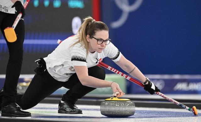 Alina Paetz of Switzerland competes in the curling women's round robin between China and Switzerland during the Milano Cortina 2026 Winter Olympic Games at the Cortina Curling Olympic Stadium in Cortina d’Ampezzo on February 13, 2026. (Photo by Tiziana FABI / AFP)