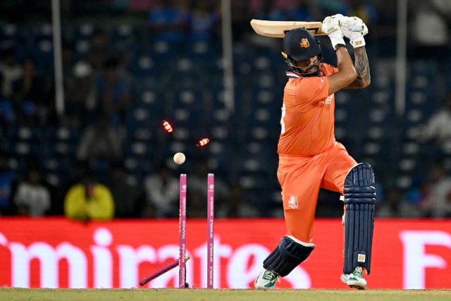 Netherlands' Aryan Dutt is clean bowled by USA's Shadley van Schalkwyk during the 2026 ICC Men's T20 Cricket World Cup group stage match between Netherlands and USA at MA Chidambaram Stadium in Chennai on February 13, 2026. (Photo by R. Satish BABU / AFP)