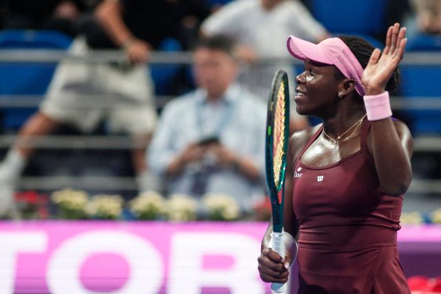 Canada's Victoria Mboko reacts after beating Latvia's Jelena Ostapenko in the women’s singles semi-final match at the Qatar Open tennis tournament in Doha on February 13, 2026. (Photo by Karim JAAFAR / AFP)