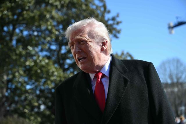 US President Donald Trump speaks to the media as he walks to board Marine One prior to departure from the South Lawn of the White House in Washington, DC, on February 13, 2026. (Photo by ANDREW CABALLERO-REYNOLDS / AFP)