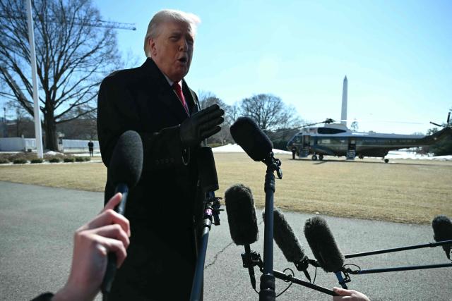 US President Donald Trump speaks to the media as he walks to board Marine One prior to departure from the South Lawn of the White House in Washington, DC, on February 13, 2026. (Photo by ANDREW CABALLERO-REYNOLDS / AFP)