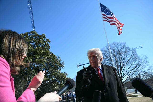 US President Donald Trump speaks to the media as he walks to board Marine One prior to departure from the South Lawn of the White House in Washington, DC, on February 13, 2026. (Photo by ANDREW CABALLERO-REYNOLDS / AFP)