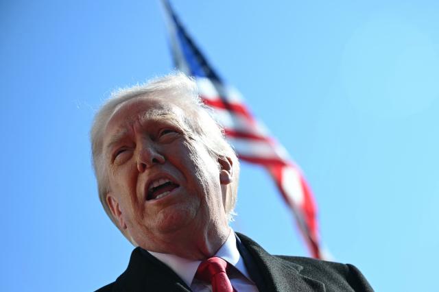 US President Donald Trump speaks to the media as he walks to board Marine One prior to departure from the South Lawn of the White House in Washington, DC, on February 13, 2026. (Photo by ANDREW CABALLERO-REYNOLDS / AFP)