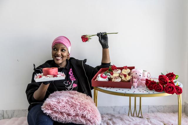 (FILES) Founder of “Four et Delices” Khoudia Ndiaye poses for a portrait next to some of her pastries ahead of Valentine's Day, in Dakar, on February 11, 2026. In the run-up to this year's Valentine's Day on February 14, 2026, romantics from Paris to Lagos and in the ongoing Olympic Games, are preparing to celebrate the Roman Saint Valentine whose feast day has since the Middle Ages been associated with courting couples. (Photo by PATRICK MEINHARDT / AFP)