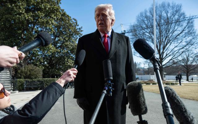 US President Donald Trump speaks to the media as he walks to board Marine One prior to departure from the South Lawn of the White House in Washington, DC, on February 13, 2026. (Photo by ANDREW CABALLERO-REYNOLDS / AFP)