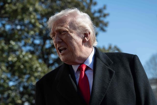 US President Donald Trump speaks to the media as he walks to board Marine One prior to departure from the South Lawn of the White House in Washington, DC, on February 13, 2026. (Photo by ANDREW CABALLERO-REYNOLDS / AFP)