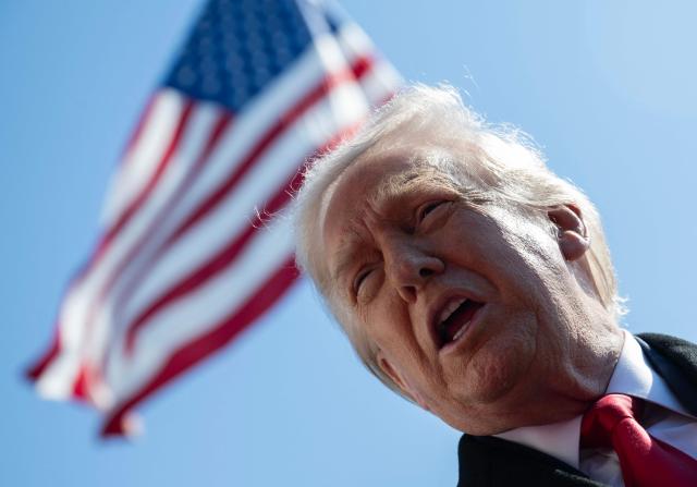 US President Donald Trump speaks to the media as he walks to board Marine One prior to departure from the South Lawn of the White House in Washington, DC, on February 13, 2026. (Photo by ANDREW CABALLERO-REYNOLDS / AFP)