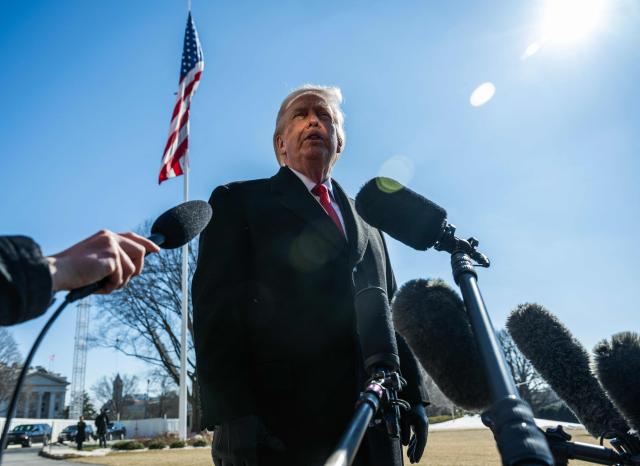 US President Donald Trump speaks to the media as he walks to board Marine One prior to departure from the South Lawn of the White House in Washington, DC, on February 13, 2026. (Photo by ANDREW CABALLERO-REYNOLDS / AFP)