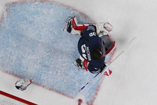 France's #36 Martin Neckar loses his helmet  during men's preliminary round Group A Ice Hockey match between France and Czech Republic at the Milano Santagiulia Ice Hockey Arena during the Milano Cortina 2026 Winter Olympic Games in Milan, on February 13, 2026. (Photo by Alexander NEMENOV / AFP)