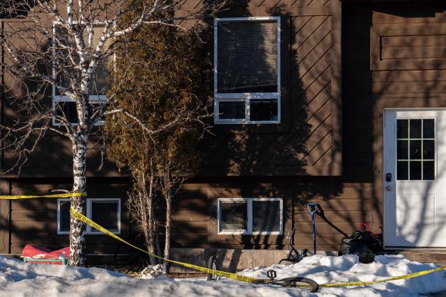 Police tape surrounds a home in Tumbler Ridge, British Columbia, Canada on February 13, 2026, where two people were found dead in one of Canadas deadliest shooting. On February 10, an 18-year-old carried out a mass shooting in a remote mining town, killing six people at a local school, after slaying her mother and stepbrother. Canadian Police commander Dwayne McDonald said authorities still don't know the motive in Tuesday's mass shooting, but the shooter, who took her own life, was known to have mental health issues. (Photo by Paige Taylor White / AFP)