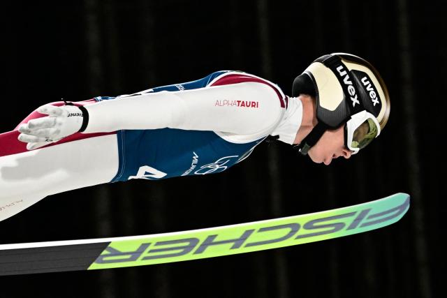 Austria's Jan Hoerl jumps during the training for the men's large hill ski jumping of the Milano Cortina 2026 Winter Olympic Games at Predazzo Ski Jumping Stadium in Predazzo (Val di Fiemme), on February 13, 2026. (Photo by Tobias SCHWARZ / AFP)