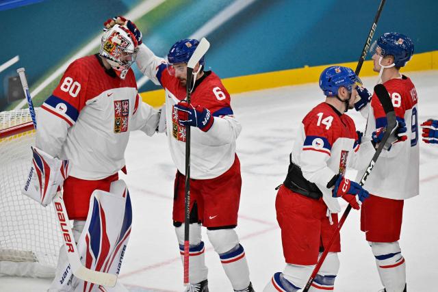 Czech Republic's players celebrate after winning men's preliminary round Group A Ice Hockey match between France and Czech Republic at the Milano Santagiulia Ice Hockey Arena during the Milano Cortina 2026 Winter Olympic Games in Milan, on February 13, 2026. (Photo by Alexander NEMENOV / AFP)